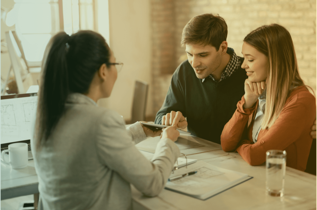 Couple discussing insurance with expert